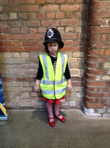 The face is because there were no ladies hats! "I don't want to be a police MAN!!"